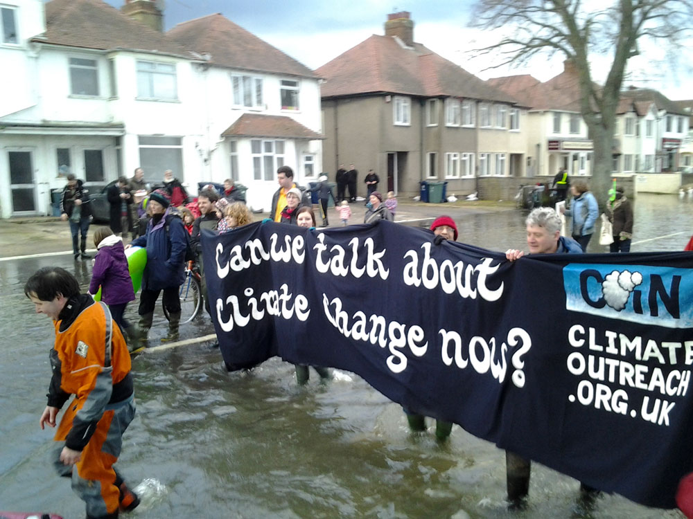 Can we talk about climate change now? A banner for COIN in February 2014
